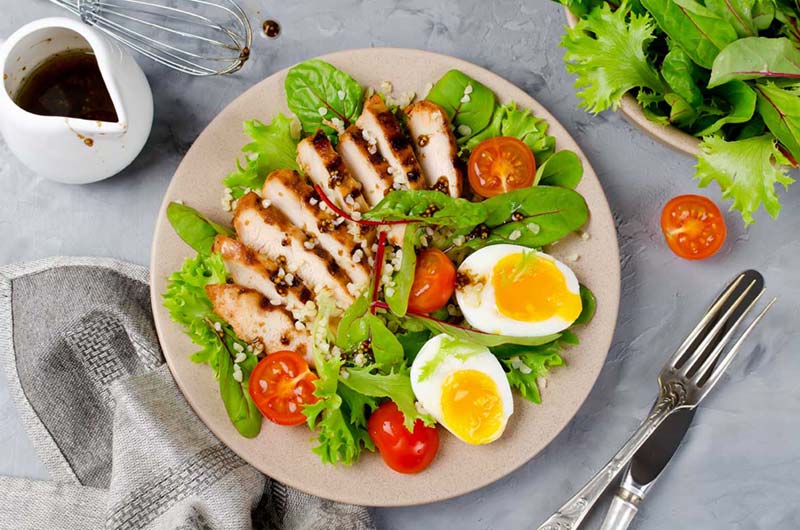 grilled chicken salad with eggs and tomatoes 